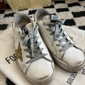 golden goose superstars - white and gold